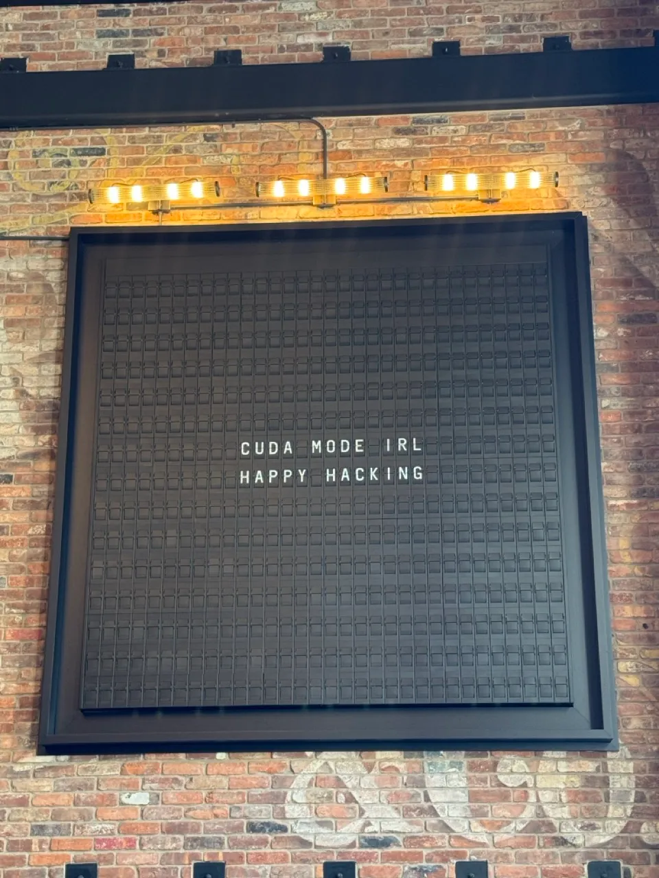 Sign with "CUDA Mode IRL, Happy Hacking"