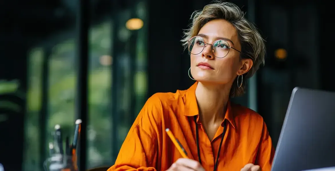 Woman in orange looking up
